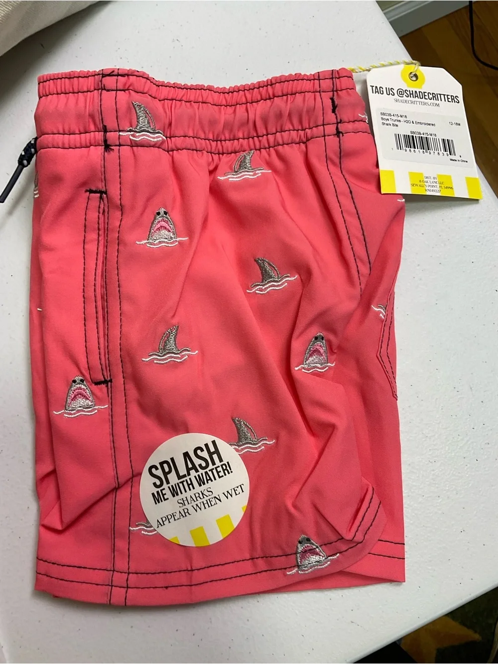 Shark Bite Boys 4 Way Stretch Water Appearing Embroidered Swim Trunks - Coral